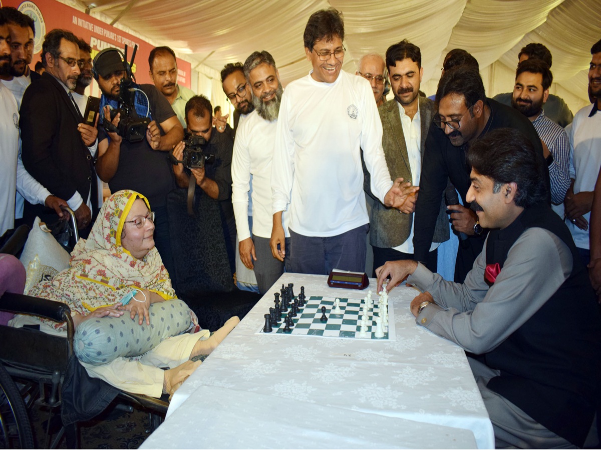 Punjab Minister for Sports and Youth Affairs Rai Taimoor Khan Bhatti plays chess with special female chess player Sahiba Shah